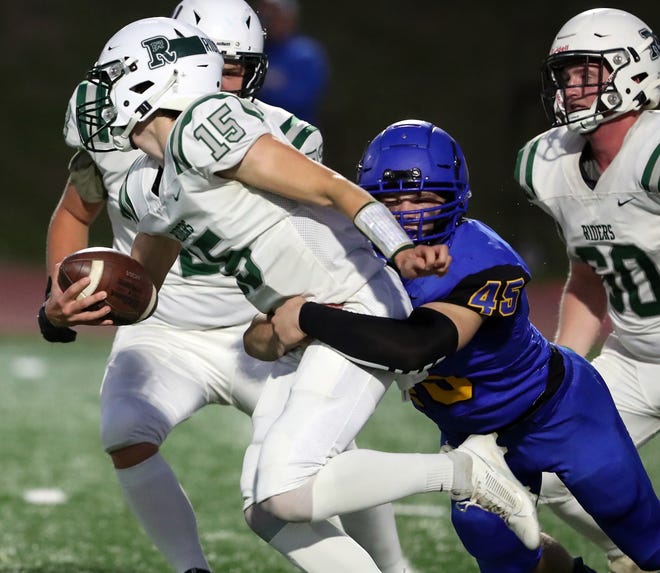 Bremerton’s Lars Michaelson (45) sacks Port Angeles quarterback Parker Nickerson (15) on Friday, Oct. 6, 2023.