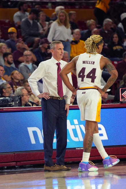 Arizona State Sun Devils head coach Bobby Hurley talks with Arizona State Sun Devils guard Adam Miller (44) during the first half of the game against the Washington Huskies at Desert Financial Arena.