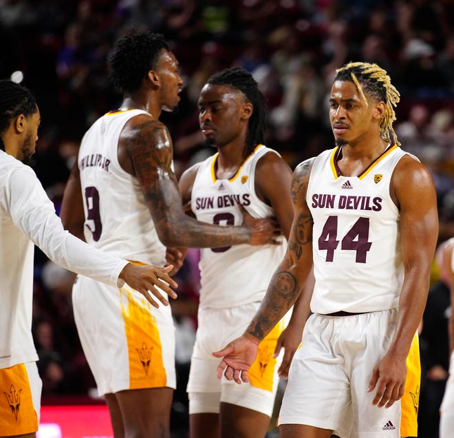 ASU guard Adam Miller (44) leaves the court down double digits in the first half during a game against Washington at Desert Financial Arena.