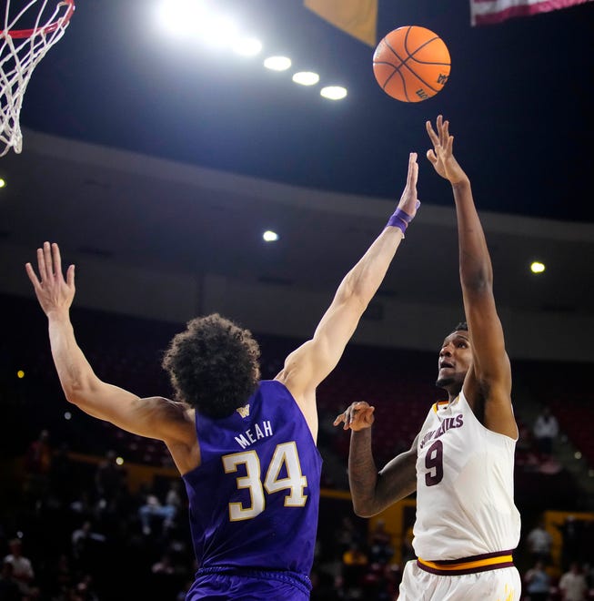 ASU center Shawn Phillips Jr. (9) shoots against Washington center Braxton Meah (34) during a game at Desert Financial Arena.