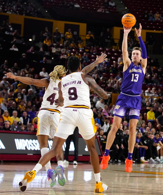 Washington forward Moses Wood (13) shoots against ASU guard Adam Miller (44) during a game at Desert Financial Arena.