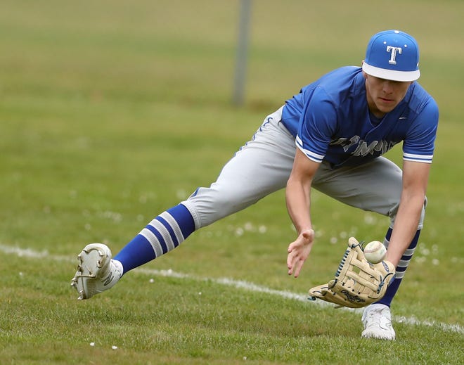 Olympic’s Gavin Wells scoops up a ground ball during their game against North Kitsap in Poulsbo on Wednesday, March 20, 2024.