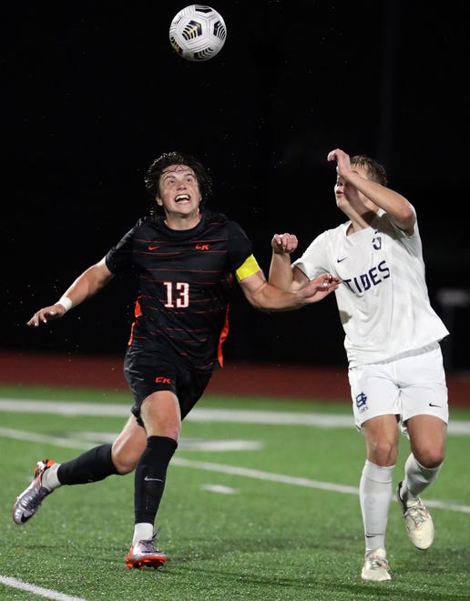 Central Kitsap’s Nicholas Strickland (13) and Gig Harbor’s Ethan Schuette (5) go up for a header during their game in Silverdale on Thursday, March 21, 2024. Central Kitsap won the game 2-1.