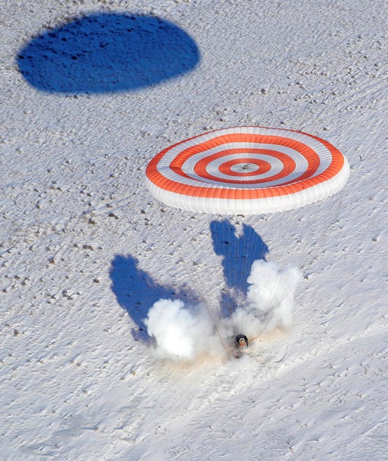 The Soyuz MS-05 space capsule carrying the International Space Station crew lands in a remote area outside the town of Dzhezkazgan, Kazakhstan, Dec. 14, 2017.